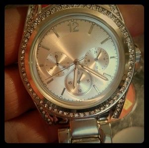 silver toned stainless steel watch w/ cz accents